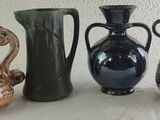 three vases sitting next to each other on a table