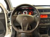 the interior of a car with a steering wheel and dashboard controls