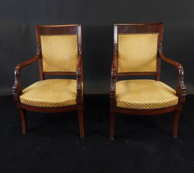 a pair of antique chairs with yellow upholstered upholstered cushions