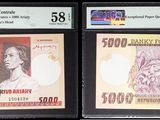 three different types of currency are on display in a display case