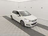the white car is parked in the garage of the house