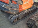 a tractor that is parked on the side of the road