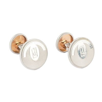 silver and rose gold cufflinks with initials on them