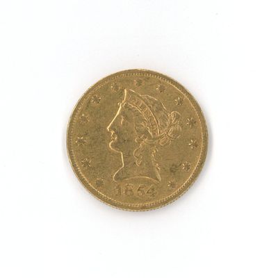 a gold coin with a picture of a woman on it