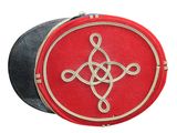 a red and black bag with a silver celtic design on it