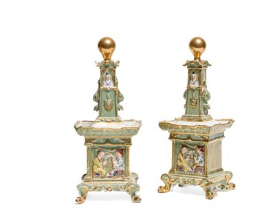 pair of 19th century french porcelain candlesticks with figures on pedestals