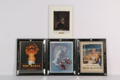 four framed movie posters are displayed on a white surface
