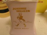 a pink pitcher with a picture of a man on it