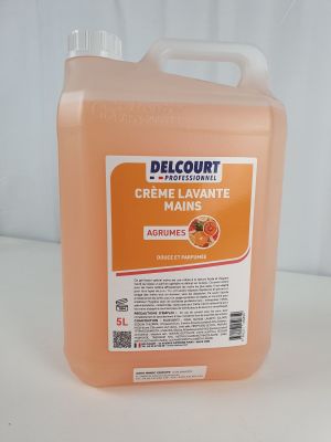 the container is full of orange juice on a white surface
