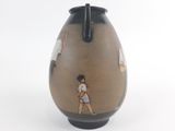 a vase with a picture of a woman and a man on it