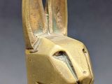 a close up of a statue of a dog wearing a mask