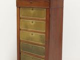 an image of a wooden chest of drawers with brass handles