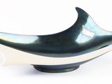 a black and white bowl on a white surface