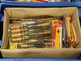 a cardboard box filled with many different types of tools
