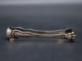 a close up of a spoon and fork on a table