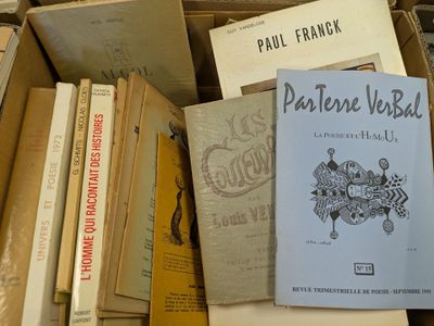 a box full of books that are stacked on top of each other