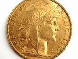 l'image d'une pièce d'or sur laquelle figure une tête de femme