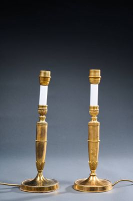 pair of brass table lamps with white glass shades