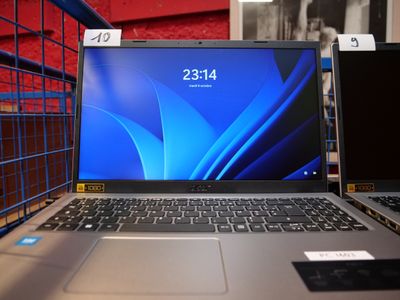 two laptops sitting on a table in a store