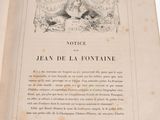 an old book with a picture of a woman on it