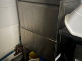 an image of a commercial kitchen with a washer and buckets