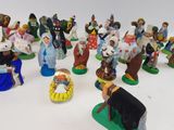 many figurines of people that are standing in a circle
