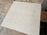 a pile of cardboard sitting on top of a pile of wood