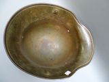 a metal bowl that is sitting on a table