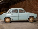 an old car that is parked in a garage