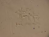 a close up of a white plate with writing on it