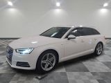 an image of a white audi wagon parked in a garage