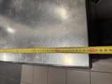 a measuring tape that is on the side of a wall