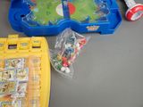 a table that has a game and a toy on it