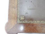 a clock that is sitting on top of a wooden table