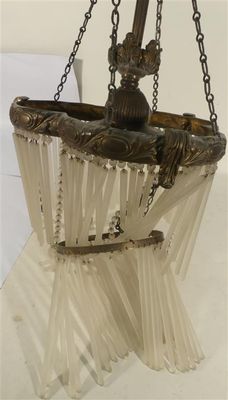 a glass hanging basket with a chain attached to it