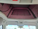 a view of the inside of a car from the passenger seat