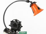 an image of a lamp with a flower on top of it