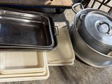 many pans and pans sitting on a table