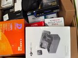 a box full of electronics and other items sitting on the floor