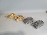 several toy tanks are lined up in a row on a white surface