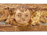a picture of a gold sculpture of a child with a starfish on it