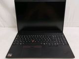 the laptop is open on a white surface with a red and black keyboard