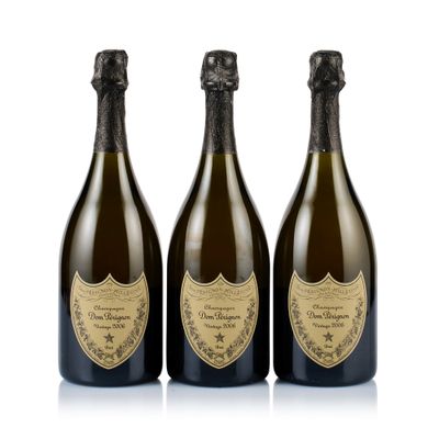 three bottles of champagne on a white background