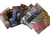 a lot of magazines that are stacked on top of each other