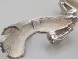 a silver object that looks like a gun on a table