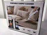 packaging of a portable carpet cleaner in a box on a table