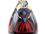 a colorful vase with a bird on it on a white background