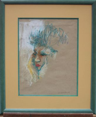 painting of a woman ' s face in a green frame on a wall