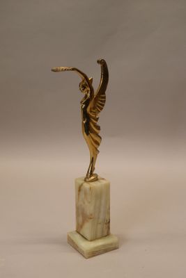 statue of an angel on a marble base