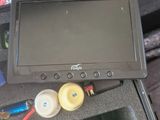 a black case that has a monitor and other items in it
